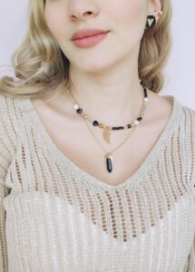 gold and black necklace