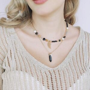 gold and black necklace